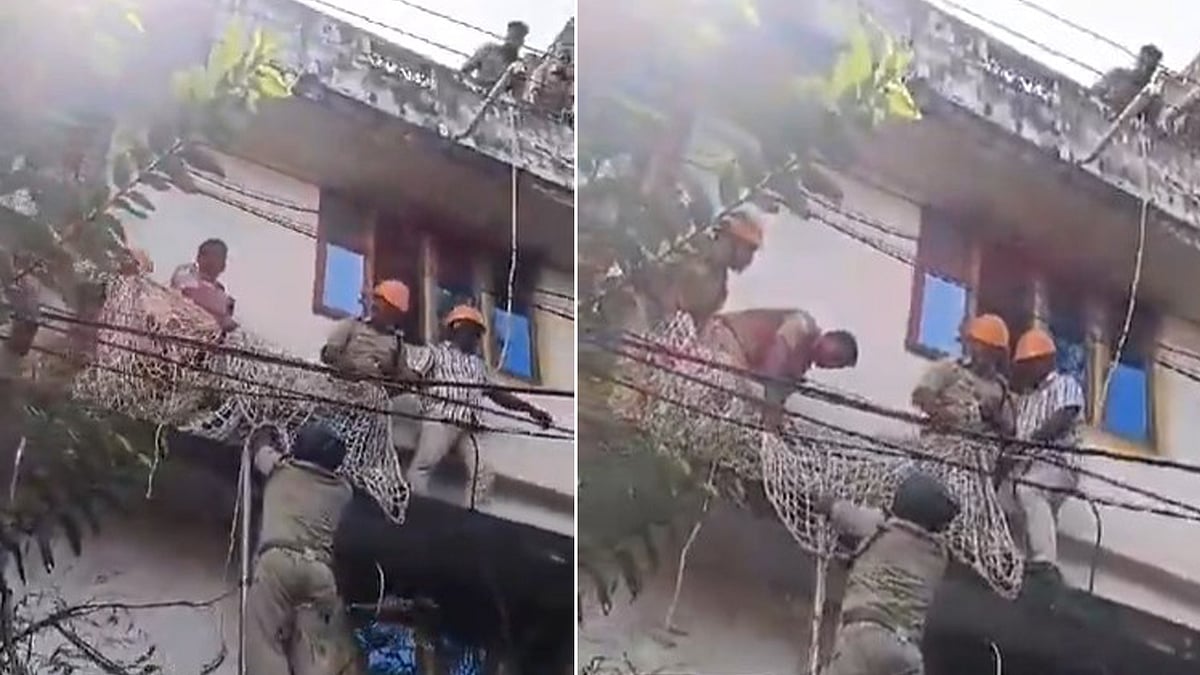 കെട്ടിടത്തിനു മുകളില്‍ കയറി യുവാവിന്റെ ആത്മഹത്യാഭീഷണി, മണിക്കൂറുകള്‍ക്കു ശേഷം വലയിട്ടു പിടിച്ചു,വിഡിയോ
