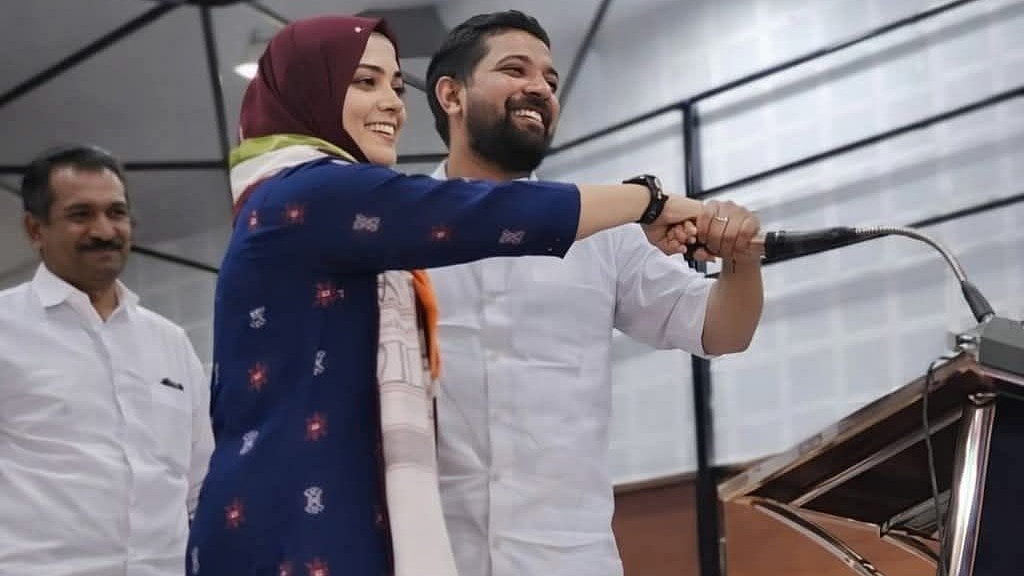 'ഫാത്തിമ തഹ്‌ലിയാ,  അന്യപുരുഷന്റെ കൈയില്‍ തൊട്ടുള്ള ഈ നില്‍പ്പ് ദീനില്‍ പറഞ്ഞതാണോ?'; ഷാഫിയുമൊത്തുള്ള ചിത്രം വൈറല്‍; ചര്‍ച്ച