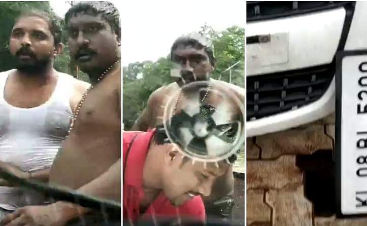 വഴിയെപോകുന്നവരെ തെറിവിളിച്ചും തലവഴി വെള്ളം കൊരി ഒഴിച്ചും മഴ ആഘോഷം; വെള്ളക്കെട്ടിലൂടെ പോയ കാറിന് നേരെ ആള്‍ക്കൂട്ടത്തിന്റെ ആക്രമണം; വീഡിയോ 