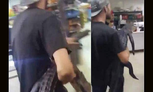 മദ്യം വാങ്ങാന്‍ യുവാവ് കടയിലെത്തിയത് ചീങ്കണ്ണിക്കുഞ്ഞുമായി ; വീഡിയോ വൈറല്‍