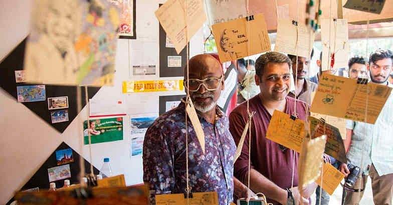 സ്വന്തം ചിത്രം പതിച്ച സ്റ്റാമ്പുകൾ വാങ്ങാം; ബിനാലെയിലെ തപാൽ വകുപ്പിന്റെ സ്റ്റാൾ ശ്രദ്ധേയമാകുന്നു
