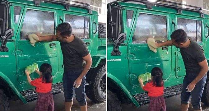 കാറു കഴുകുന്ന ധോനി, അച്ഛനെ സഹായിച്ച് സിവ (വീഡിയോ)