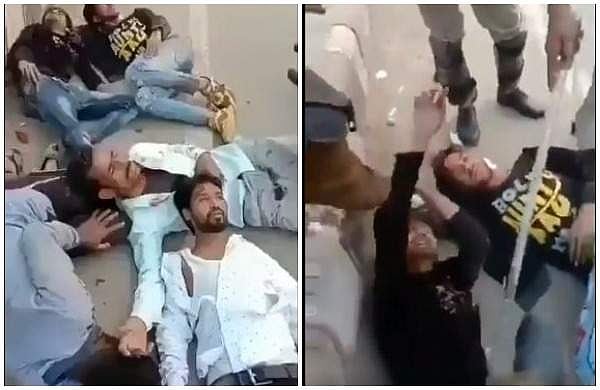 അവശരായി നിലത്ത് കിടക്കുന്ന മനുഷ്യര്‍, ലാത്തി കൊണ്ട് കുത്തി ജനഗണമന പാടിക്കുന്ന പൊലീസ്; ആസാദി വിളിക്കെടാ എന്ന് ആക്രോശം (വീഡിയോ)