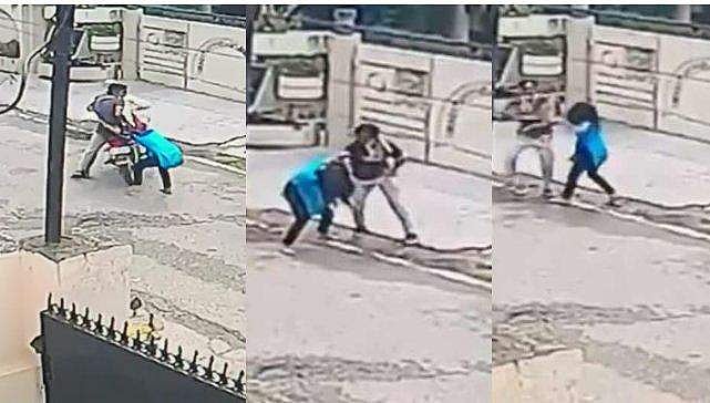 മൊബൈല്‍ മോഷ്ടിച്ച് കടക്കാന്‍ ശ്രമം; നടുറോഡില്‍ പിടിവലി, ബൈക്കിലെത്തിയ മോഷ്ടാവിനെ ചെറുത്ത് 15 കാരി ( വീഡിയോ) 