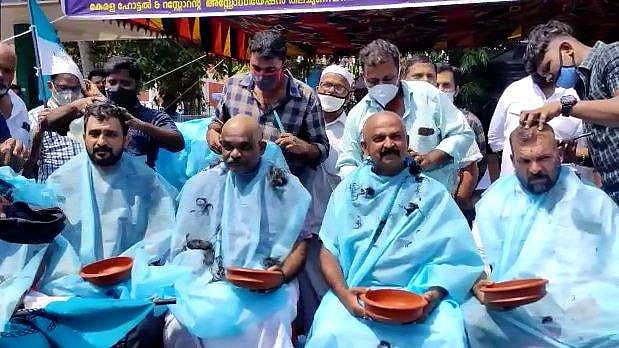 പാചക വാതക വില വര്‍ധനയ്‌ക്കെതിരെ കൂട്ട മൊട്ടയടി; ഹോട്ടല്‍ ഉടമകളുടെ പ്രതിഷേധം (വീഡിയോ)