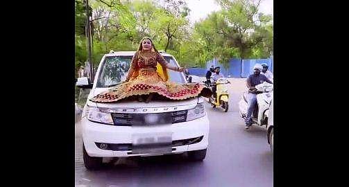 ഓടുന്ന കാറിന്റെ ബോണറ്റില്‍ ഇരുന്നു വിഡിയോ ഷൂട്ട്; 'കല്യാണപ്പെണ്ണി'ന് 16,500 രൂപ പിഴ